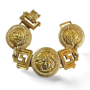 Vintage Gianni Versace gold tone medusa face motif bracelet with crystals. Must have Lady Gaga style jewelry piece. 060308m