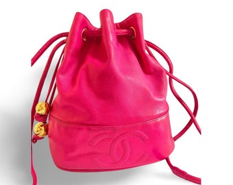 Vintage CHANEL fusia pink lambskin hobo bucket shoulder bag with CC golden balls and CC stitch mark. 050919ac1