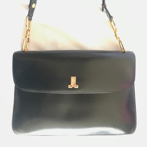 Vintage Lanvin black leather shoulder bag with logo motif. Classic masterpiece. 050320r11