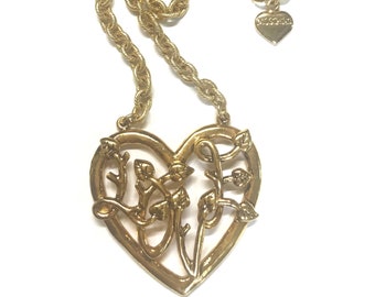 Vintage Moschino golden chain necklace with large arabesque heart design pendant top. Moschino BIJOUX jewelry. LOVE