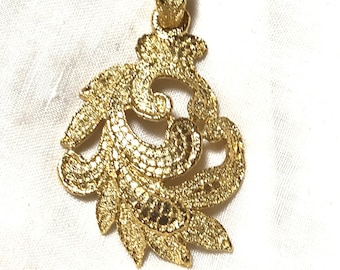 MINT. Vintage Yves Saint Laurent golden arabesque design pendant top. YSL leaf design top. Enjoy it with your own necklace.