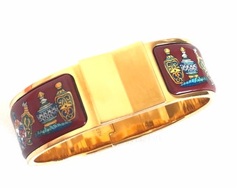 Vintage Hermes cloisonne enamel golden click and clack Flacon bangle with wine red and colorful perfume bottle design. 050406r8