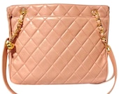 Vintage CHANEL milky pink lambskin shoulder tote bag with gold tone chain straps and CC ball charm. Classic purse.