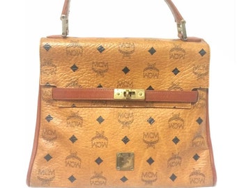 Vintage MCM classic brown monogram Kelly bag with golden logo plate. P –  eNdApPi ***where you can find your favorite designer  vintages..authentic, affordable, and lovable.