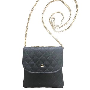 Vintage Chanel black quilted satin fabric mini pouch, coin purse, long necklace with golden chain and CC motif. Fiocci snap. 060516re2