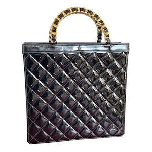 Vintage CHANEL black matelasse enamel shopper bag with golden chain handles. Quilted patent enamel bag for daily use. 050120an2