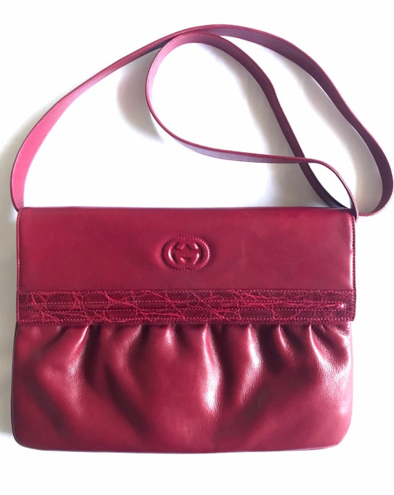 Vintage GUCCI wine red shoulder bag with GG engrav