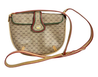 Vintage Gucci GG monogram shoulder bag with red and green webbing color convo shoulder bag. Golden and silver GG motif on the flap. 0411273