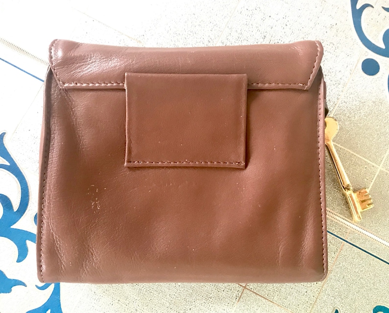 So chic and mod. Vintage MOSCHINO brown leather purse can be fanny bag clutch bag with large golden heart and key motifs