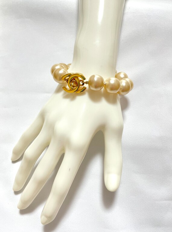 Vintage Chanel faux pearls and turnlock CC bracelet. … Gem