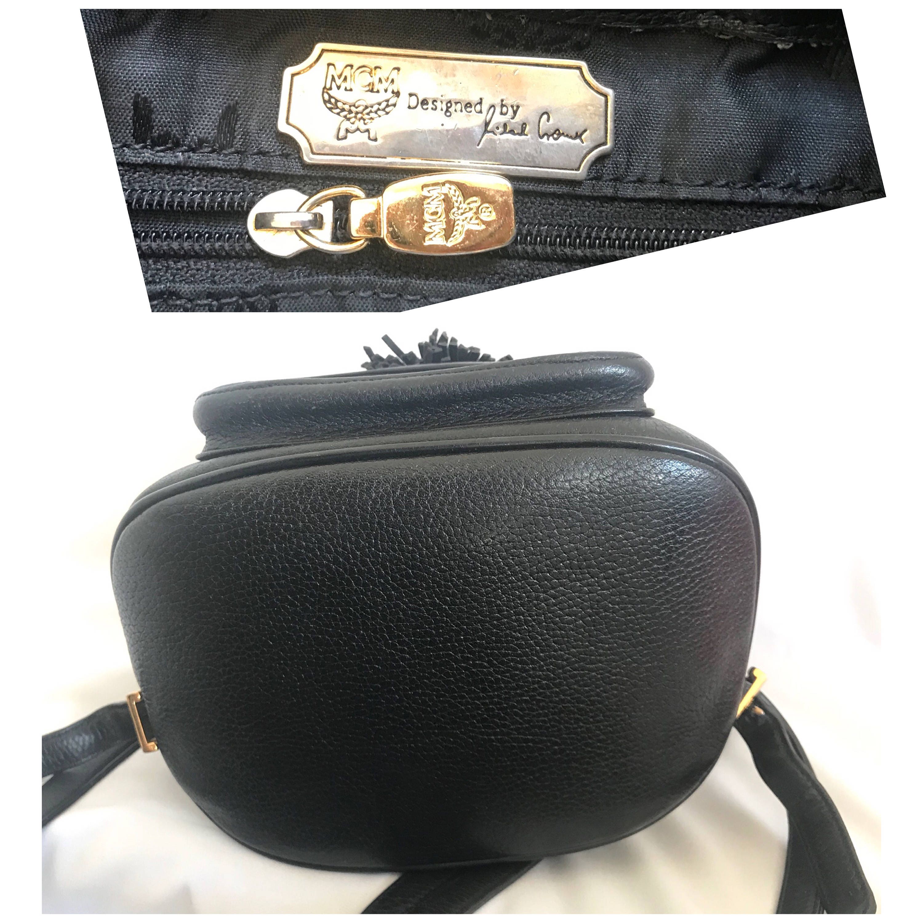 Vintage MCM Black Backpack With Golden Studded Logo Motifs  display picture 1
