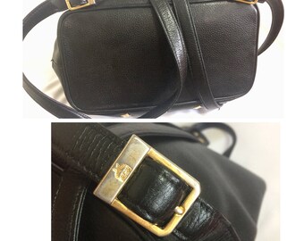 Vintage MCM black leather backpack with golden studded logo motifs. Designed by Michael Cromer. Unisex bag for daily use.
