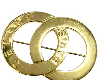 CELINE ゴールド ダブルリングブローチ Vintage CELINE Double Circle Gold Tone Brooch With Embossed Logo