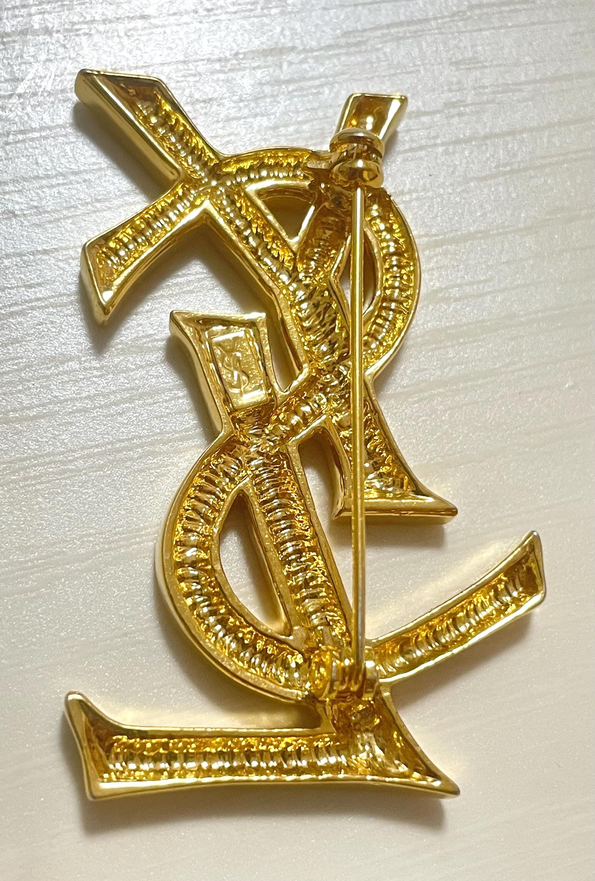1990s. Vintage Yves Saint Laurent YSL Logo Gold-tone Brooch Pin