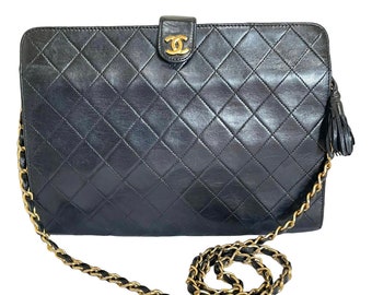 Vintage CHANEL black leather diary book design 2.55 flap shoulder bag with gold tone CC closure. 0407232