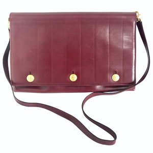 Vintage FENDI wine leather shoulder bag, large clutch purse with iconic Janus medallion embossed motifs at front. Unisex. 060620re5