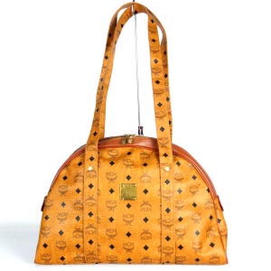 Vintage MCM brown monogram shoulder bag in bolide shape. Classic style in originality. 070401k3ys