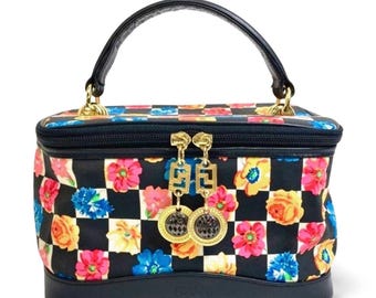Vintage Gianni Versace black leather vanity bag with vibrant pink, orange, and blue floral chess print and dangling charms. 080513k5ys