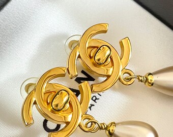 Vintage CHANEL gorgeous dangling earrings with large CC mark and butto –  eNdApPi ***where you can find your favorite designer  vintages..authentic, affordable, and lovable.