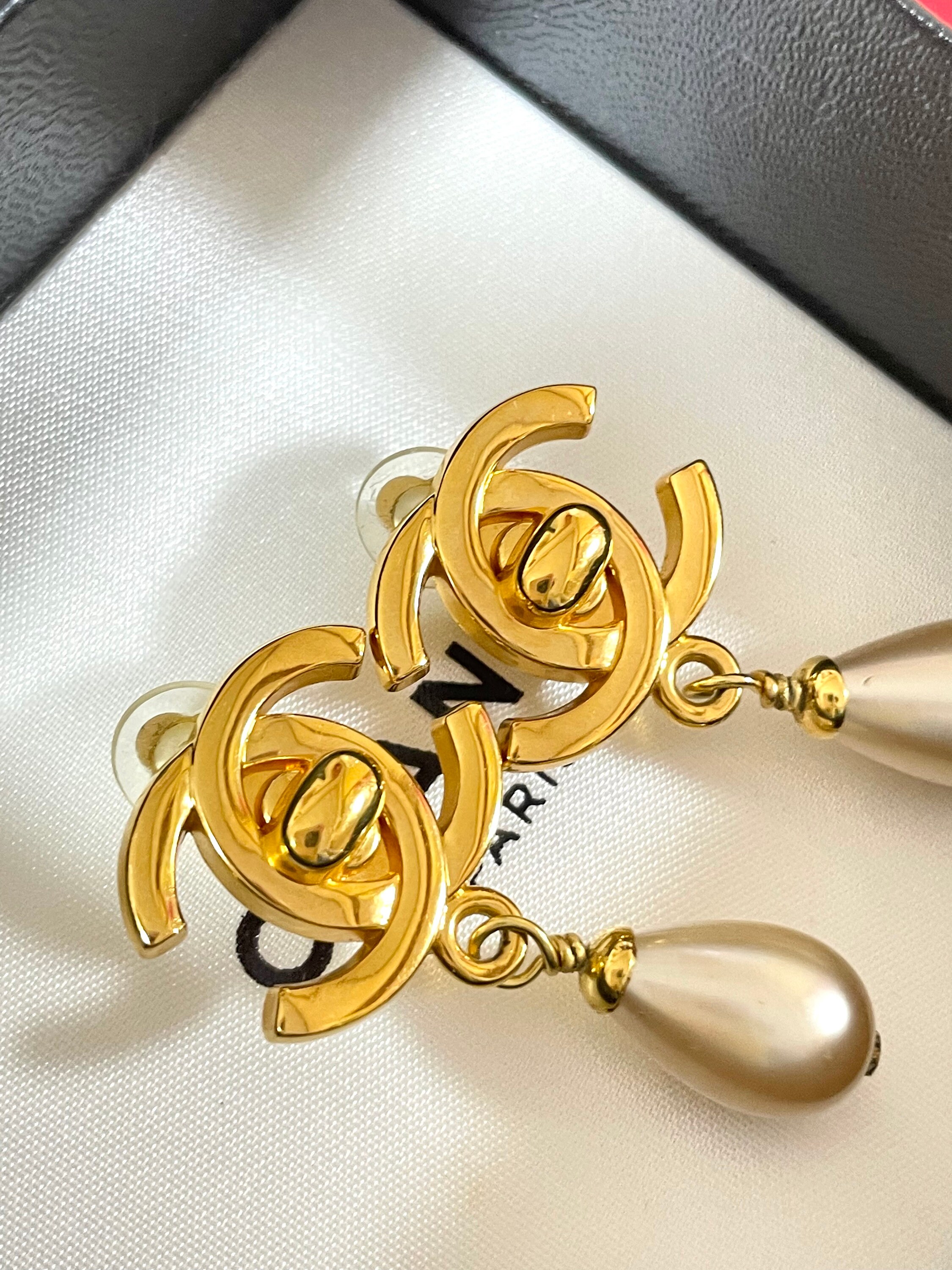 Vintage CHANEL large white faux pearl dangle earrings with golden roun –  eNdApPi ***where you can find your favorite designer vintages..authentic,  affordable, and lovable.