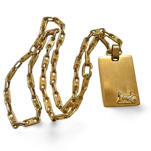 Vintage Celine golden necklace with triomphe chains and a carriage and logo featured rectangular plate top. 070218ys2