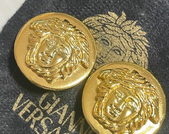 Vintage Gianni Versace round gold tone medusa face motif earrings. Classic Medusa head jewelry. 0702171