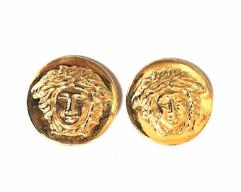 Vintage Gianni Versace round gold tone medusa face motif earrings. Must have Lady Gaga style jewelry piece. Great gift. 060523re3