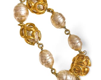Vintage Salvatore Ferragamo chain bracelet with faux baroque pearl and golden arabesque style charms. 070520ac5