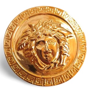 Vintage Gianni Versace gold tone medusa motif round pin brooch. Can be hat, jacket pin etc too. Gorgeous and classic jewelry. 070609k3m