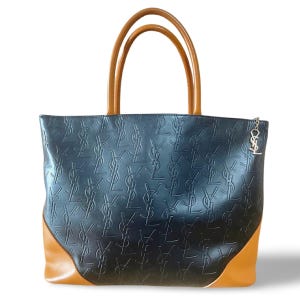 Vintage Yves Saint Laurent YSL logo embossed black leather tote bag, handbag purse with brown leather trimmings and logo charm. 070708ac3
