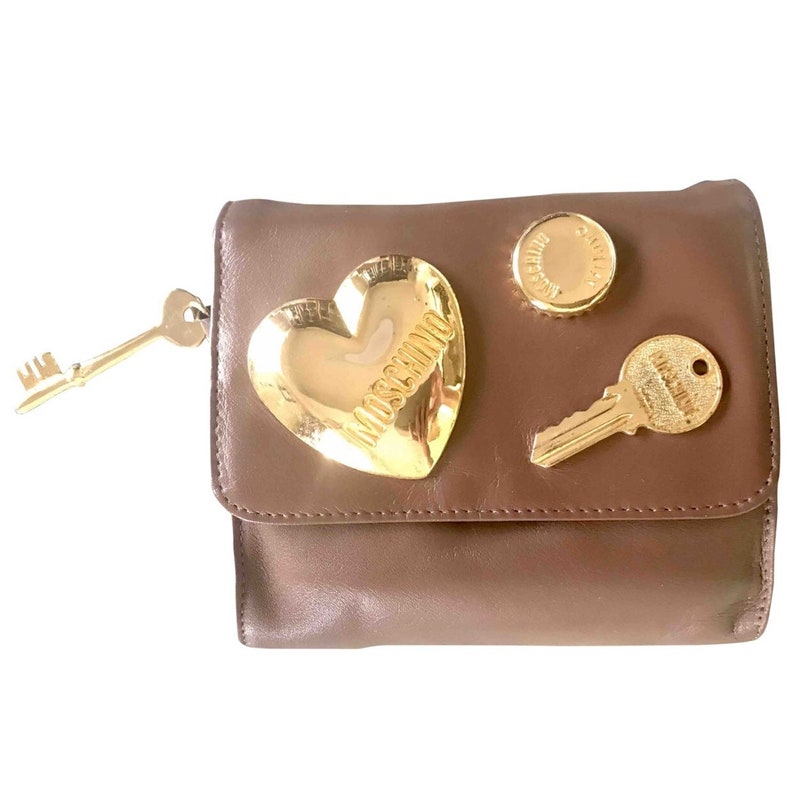 So chic and mod. Vintage MOSCHINO brown leather purse can be fanny bag clutch bag with large golden heart and key motifs