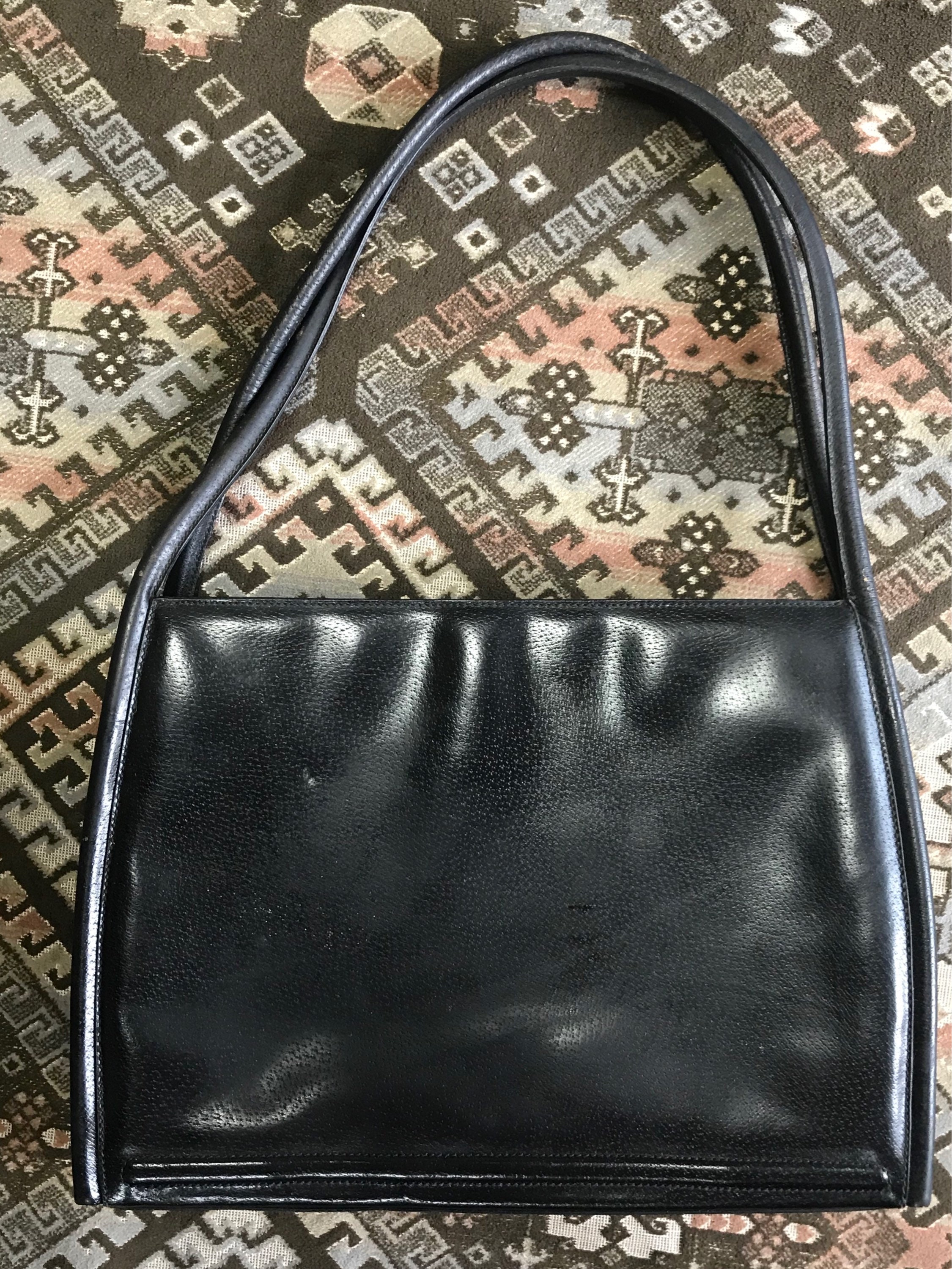 Vintage Gucci Black Pigskin Large Trapezoid Shape Shoulder Bag with Embossed GG Mark. Classic Leather Purse For Daily Use.