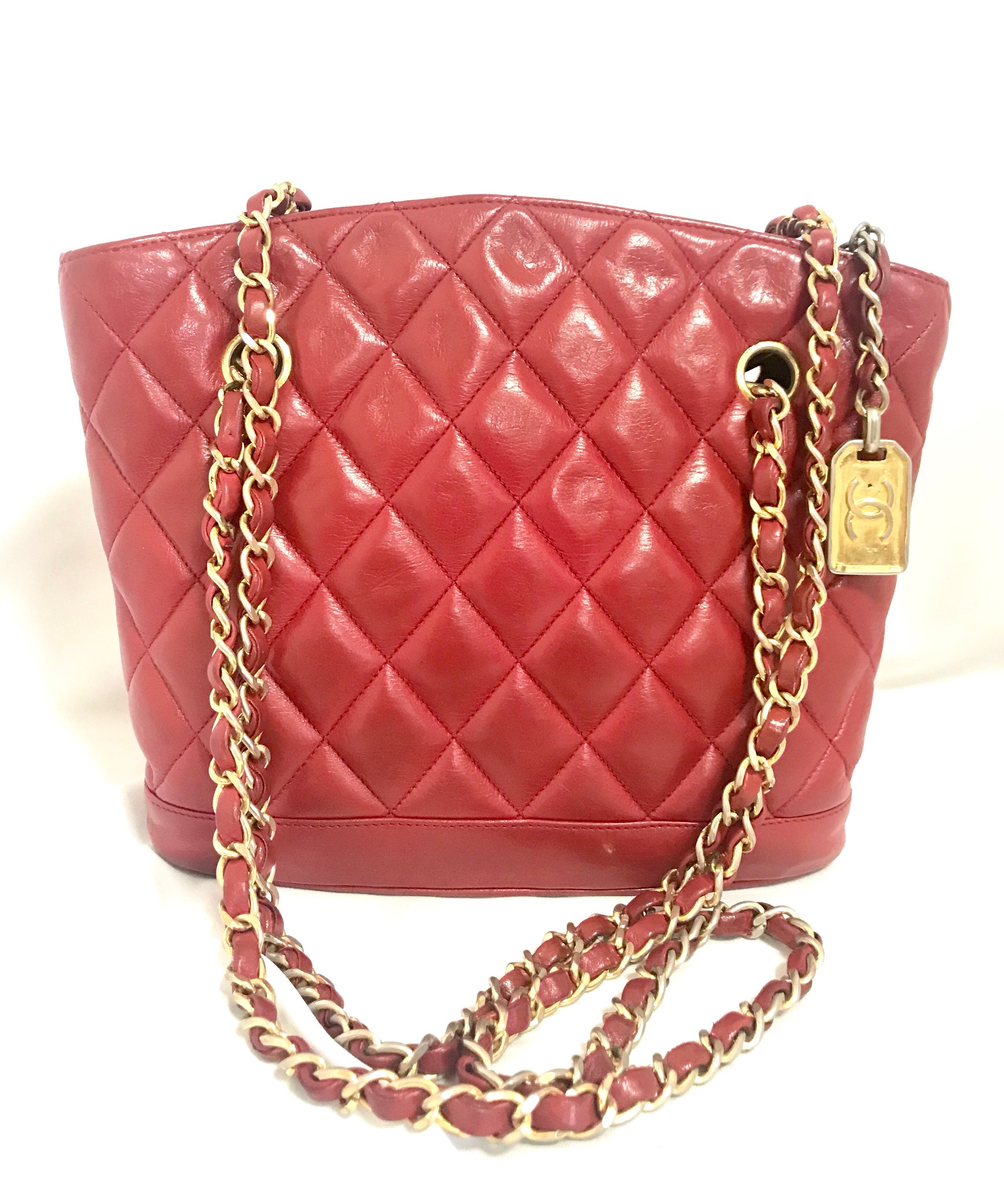 Vintage CHANEL red lamb leather shoulder bag with golden CC button motifs  at flap. Rare purse.