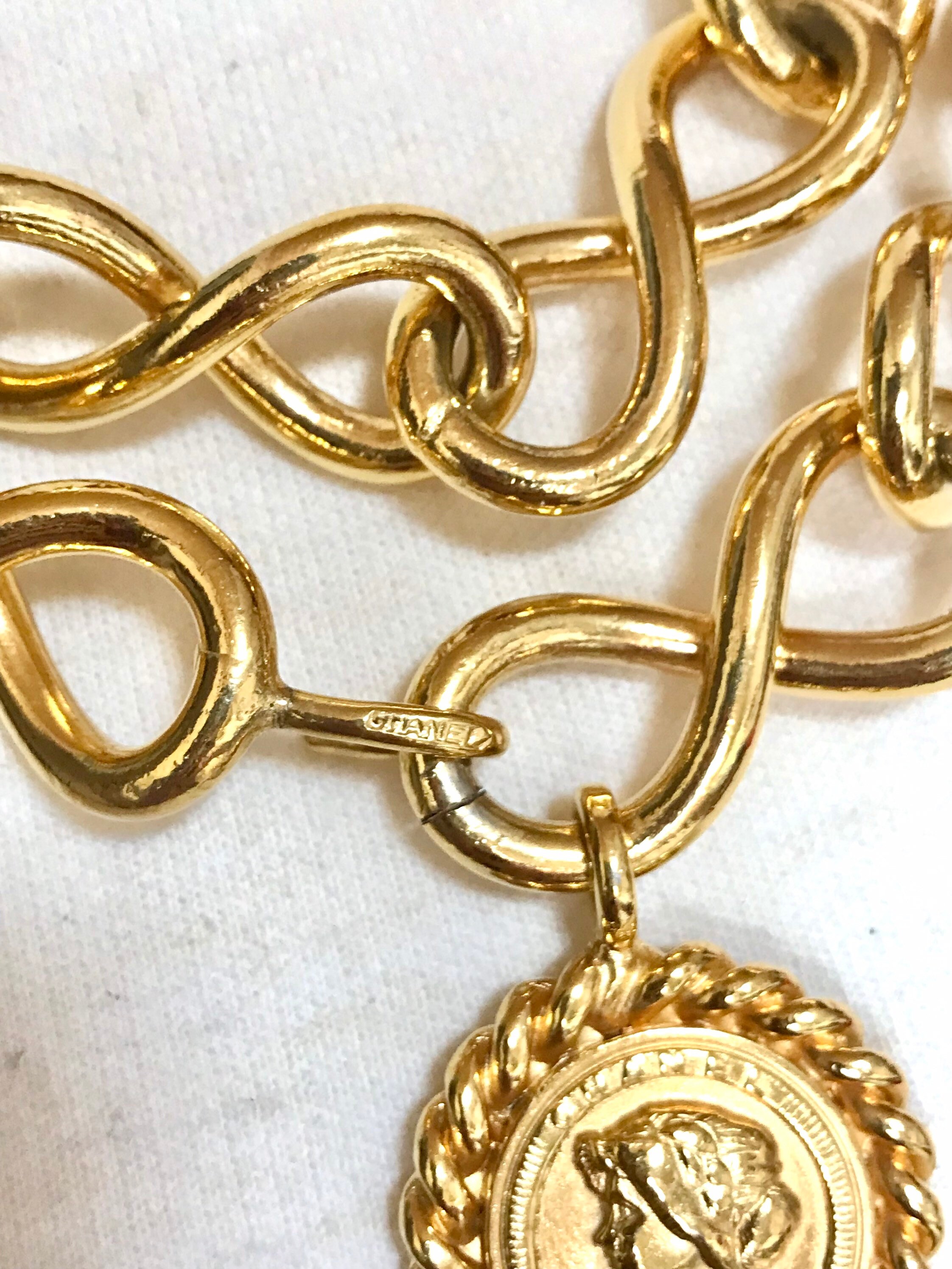 90’s. Vintage CHANEL thick chain belt with golden mademoiselle and CC charm. CHANEL Gold Chain Belt/ Necklace with Iconic Mosaic Double  main image 3