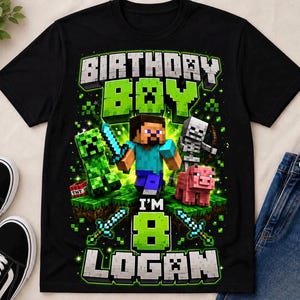 May include: A black t-shirt featuring a Minecraft-themed graphic with the text "BIRTHDAY BOY I'M 8 LOGAN". The design includes pixelated characters like Steve, a Creeper, a skeleton, and a pig, along with swords and TNT blocks in green and blue.