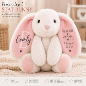 May include: A plush white bunny with long, soft ears featuring pink inner fabric. The left ear displays the name Everly with a large letter E, and the right ear shows birth details: May 15, 2025, 2:47 AM, 7 lbs 4 oz, and 19.5 in.