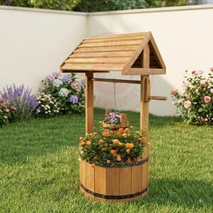 May include: A wooden wishing well planter featuring a slatted roof, a central support beam with a crank handle, and a cylindrical base reinforced with black metal bands. The structure contains a hanging bucket filled with purple and orange flowers.