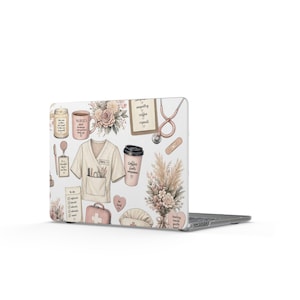 May include: A laptop skin featuring a cream-colored scrub top, a stethoscope, a coffee cup, a medical bag, and floral arrangements in soft pink and beige tones. The design includes text such as "Nurses plant kindness everywhere they go," "empathy coffee repeat," "coffee fuels compassion," and "be kind" alongside a to-do list.