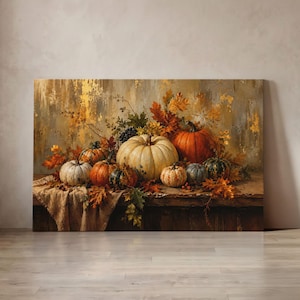May include: A rectangular canvas wall art print featuring a still life painting of various pumpkins and gourds in shades of orange, white, and green, arranged on a wooden surface with scattered autumn leaves and a textured, neutral-toned background.