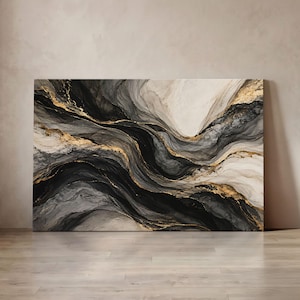 May include: A rectangular canvas wall art piece featuring an abstract fluid design with flowing waves of black, charcoal grey, and cream tones. The composition is accented with metallic gold veins that follow the curves of the dark paint.