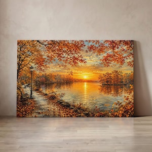 Könnte beinhalten: Ein rechteckiger Wandkunstdruck, der einen lebhaften Herbstsonnenuntergang über einem ruhigen See zeigt. Die Szene umfasst einen von orangefarbenen und gelben Bäumen gesäumten Weg, eine schwarze Laterne, eine Parkbank und goldenes Sonnenlicht.