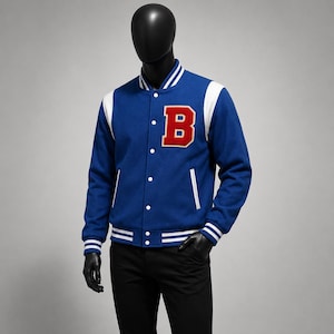 May include: A blue varsity jacket featuring white sleeves, a red letter B patch on the left chest, white snap buttons, and white striped ribbed trim on the collar, cuffs, and hem. The jacket is displayed on a black mannequin wearing black pants.