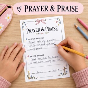 May include: A white paper sheet titled Prayer & Praise with sections for Prayer Request and Praise Report. The form features a pink bow, floral illustrations, a candle, and a cross. It is filled out with handwritten text by Emma on Sept. 9.