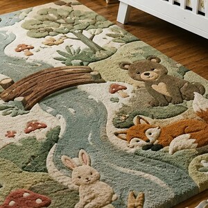 May include: A textured area rug featuring a forest scene with a winding blue river, a wooden bridge, and various animals including a brown bear, an orange fox, and a beige rabbit. The design includes green trees, small mushrooms, and foliage.