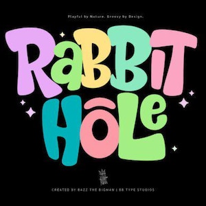 May include: A graphic design featuring the text RABBIT HOLE in large, rounded, multi-colored letters including lavender, yellow, mint green, pink, and teal against a black background. Small white four-pointed stars surround the text.