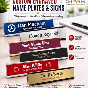 May include: A collection of six rectangular desk name plates in various colors including blue, silver, maroon, black, red, and gold. Each plate features engraved text such as Dan Mecham, Coach Reynolds, Mrs. White, and Dr. Roberts with titles.