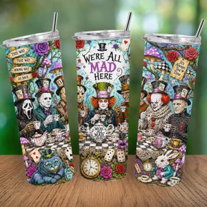 May include: A cylindrical stainless steel tumbler with a lid and straw, featuring a colorful wrap-around print of horror movie characters at a tea party. The design includes the text "WE'RE ALL MAD HERE" and "It's Always Tea Time" with mushrooms, playing cards, and a clock.