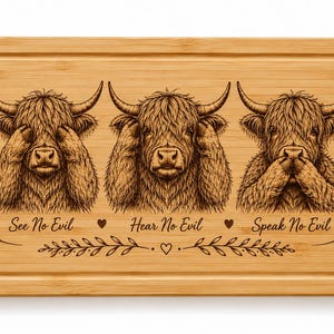 May include: A rectangular bamboo cutting board featuring a laser-engraved illustration of three Highland cows. The cows are depicted in the classic see no evil, hear no evil, and speak no evil poses, with the corresponding text engraved below each.
