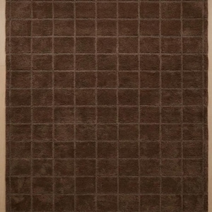 May include: A rectangular area rug in a solid dark brown color featuring a uniform grid pattern of raised square tufts. The surface texture is consistent throughout, creating a repeating geometric design across the entire floor covering.