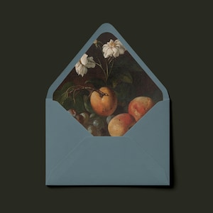 May include: A dusty blue envelope with a pointed flap, featuring an interior liner printed with a classical still life painting of white flowers, green leaves, and orange fruits against a dark, moody background.